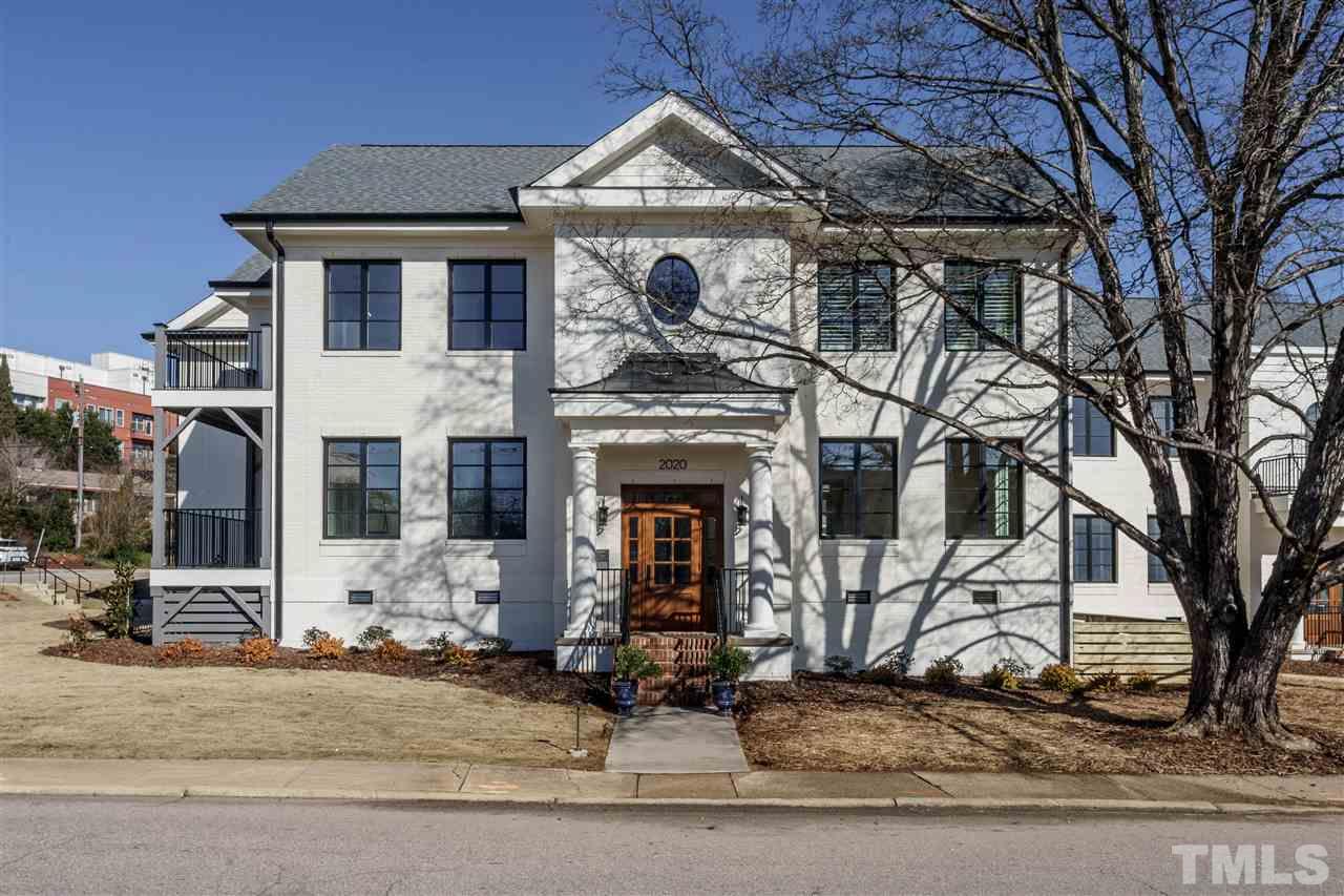 604 Daniels Street, Unit B Raleigh, NC 27605 - Photo 1 of 20 a front view of a house with a yard