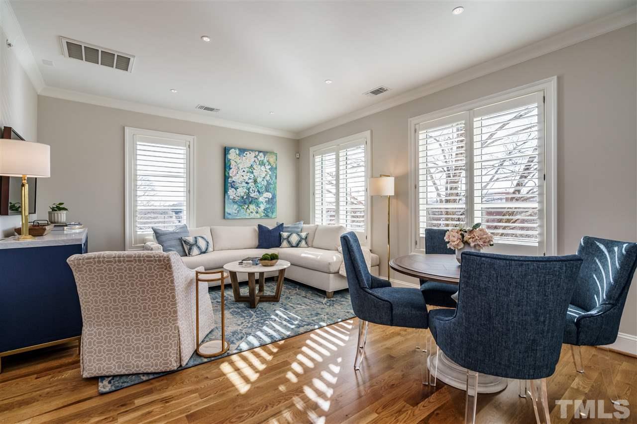 604 Daniels Street, Unit B Raleigh, NC 27605 - Photo 2 of 20 a living room with furniture and large windows