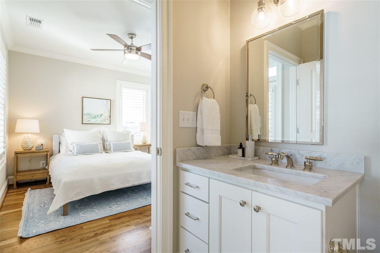 604 Daniels Street, Unit B Raleigh, NC 27605 - Photo 12 of 20 a en suite bathroom with a double vanity sink and a mirror