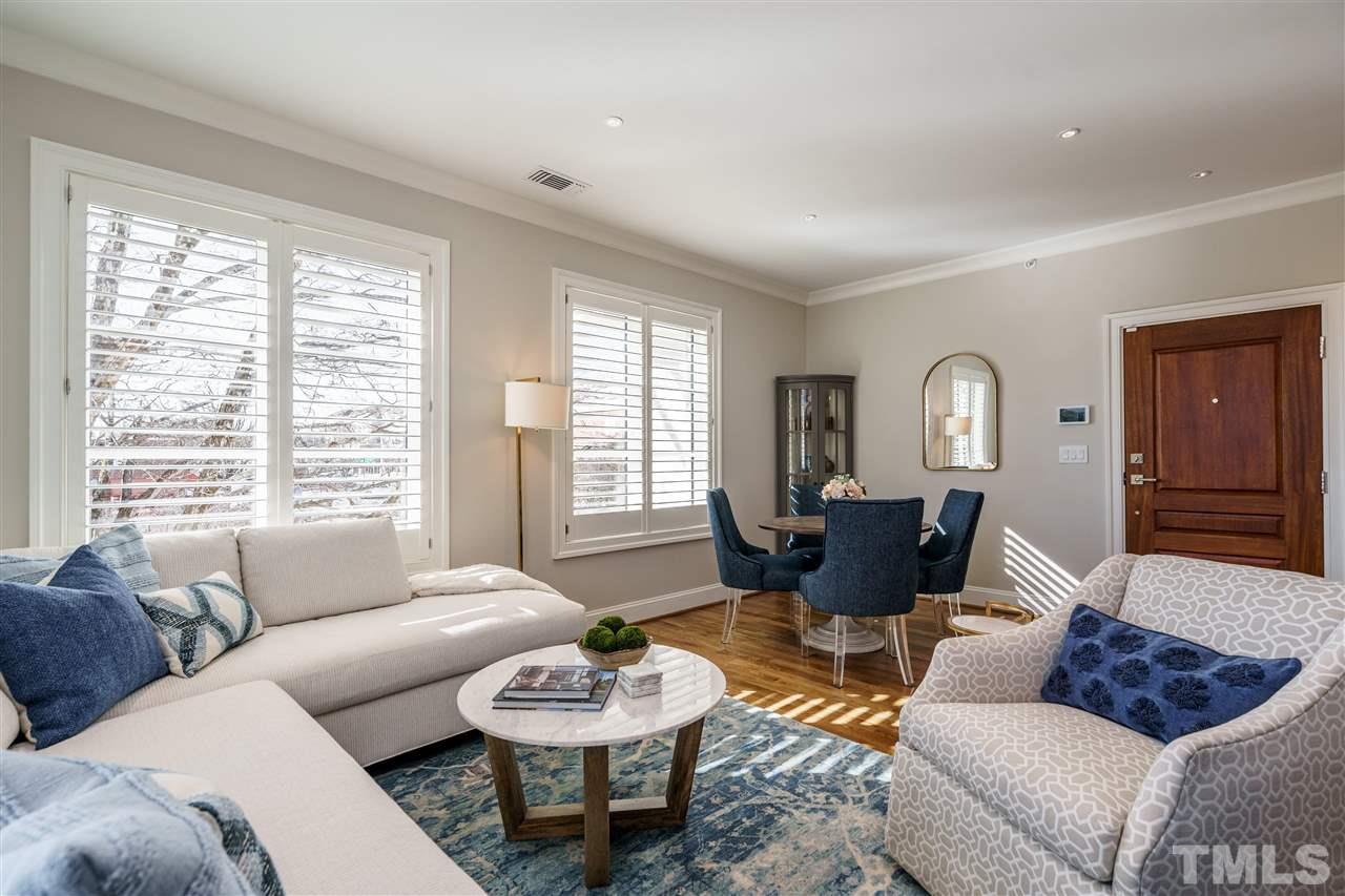 604 Daniels Street, Unit B Raleigh, NC 27605 - Photo 4 of 20 a living room with furniture and a large window