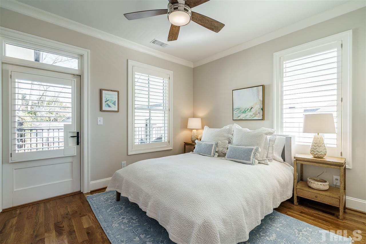 604 Daniels Street, Unit B Raleigh, NC 27605 - Photo 9 of 20 a bedroom with a large bed and a window