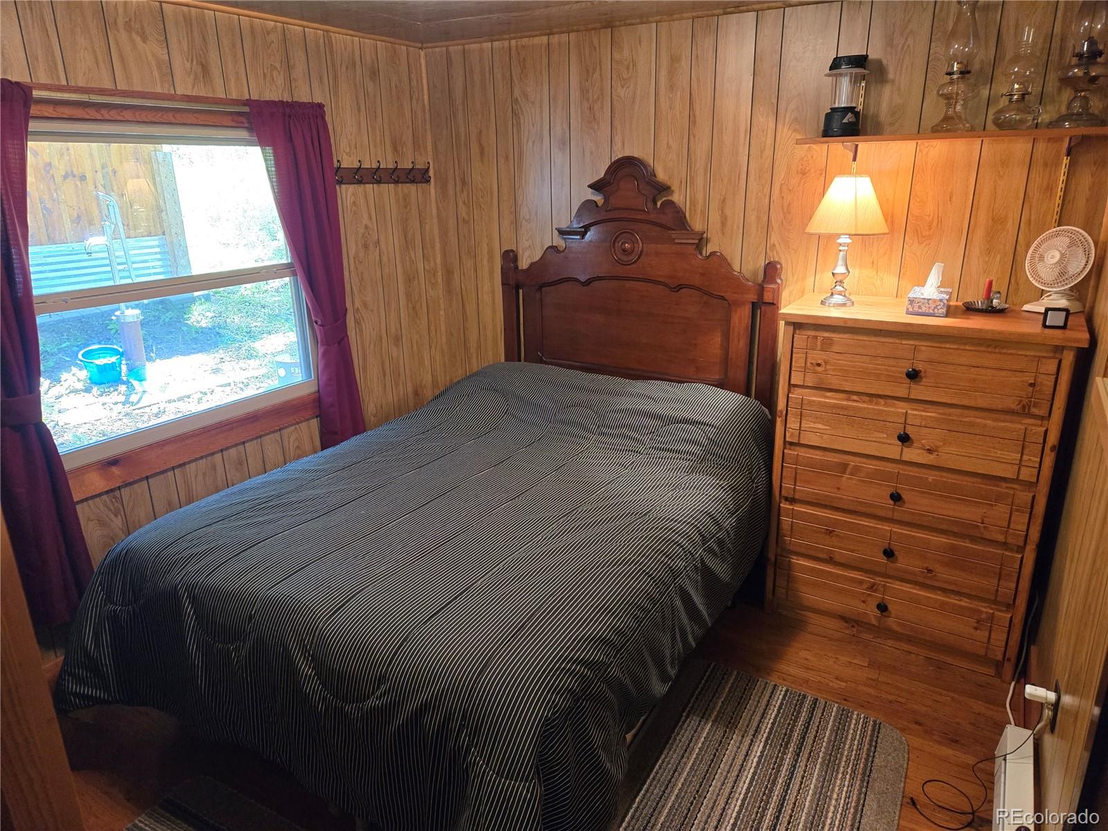 9626 Highway 165 Rye, CO 81069 - Photo 14 of 27 a bedroom with a bed and a window