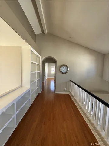 a view of hallway with wooden floor
