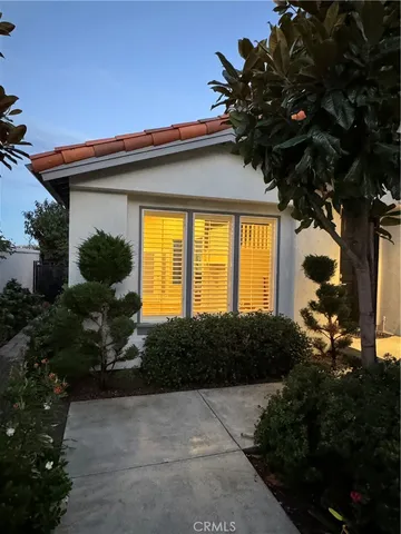 a front view of house with garden