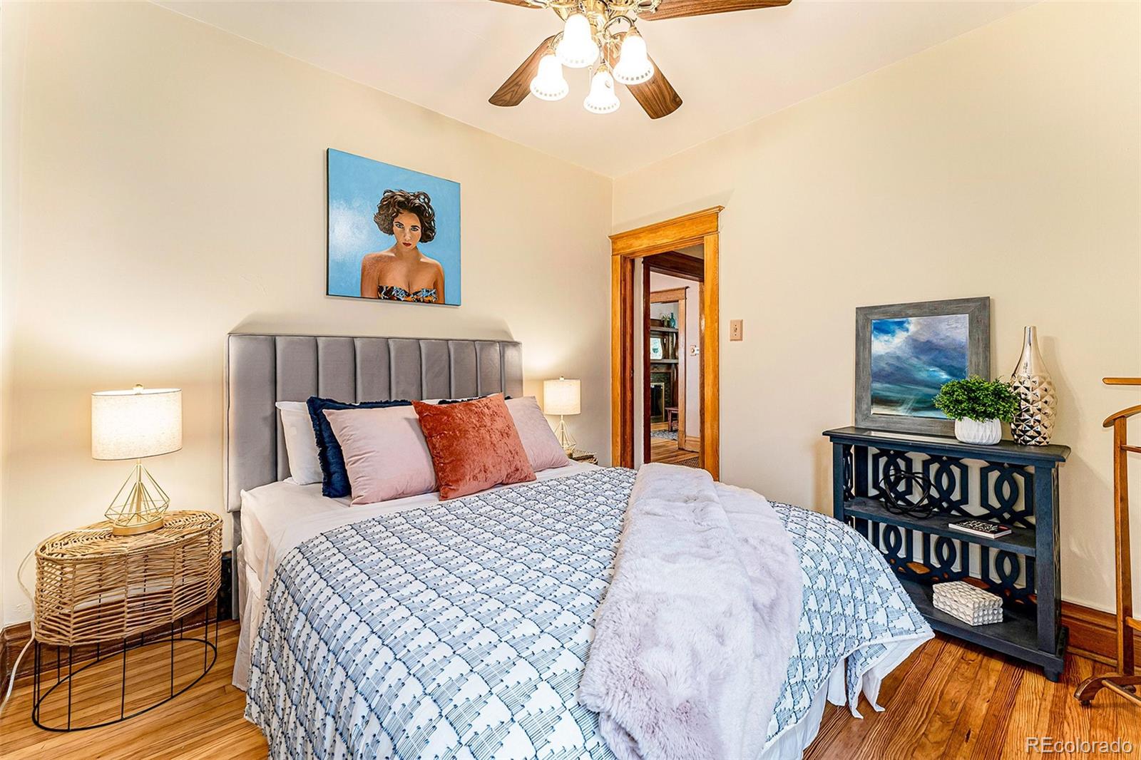 3548 Clay Street Denver, CO 80211 - Photo 16 of 30 a bedroom with a bed and a chandelier