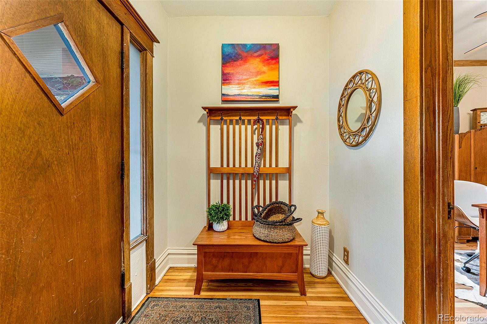 3548 Clay Street Denver, CO 80211 - Photo 18 of 30 a front view of a house with entryway and wooden floor