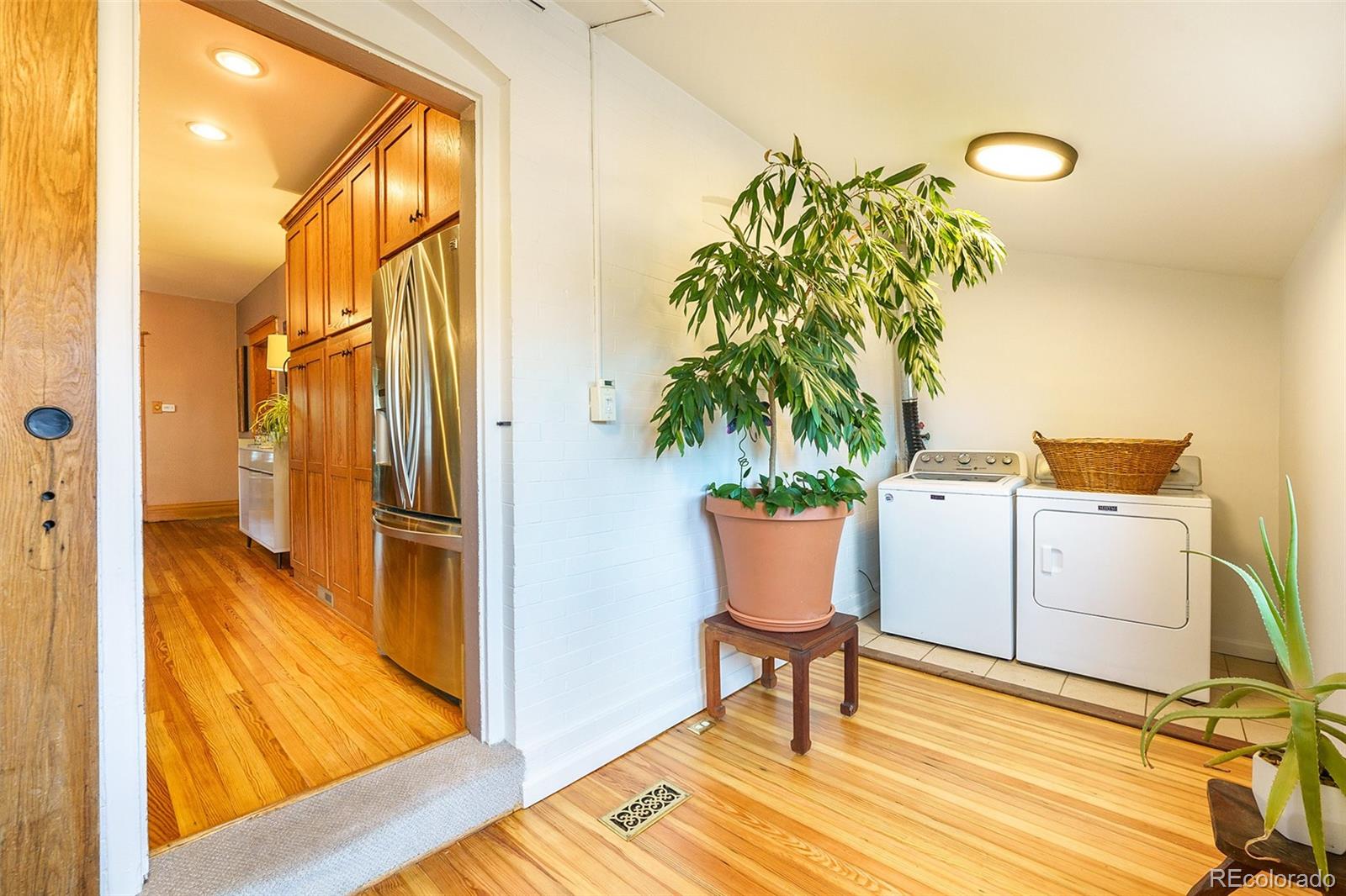 3548 Clay Street Denver, CO 80211 - Photo 19 of 30 a workspace with furniture and a potted plant