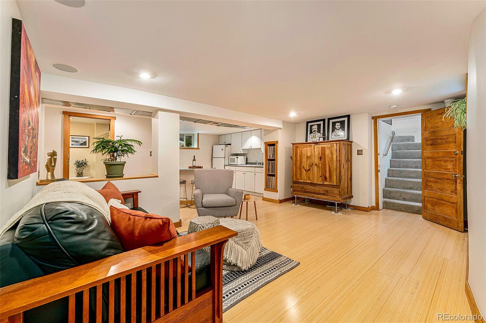 3548 Clay Street Denver, CO 80211 - Photo 21 of 30 a living room with furniture and a flat screen tv