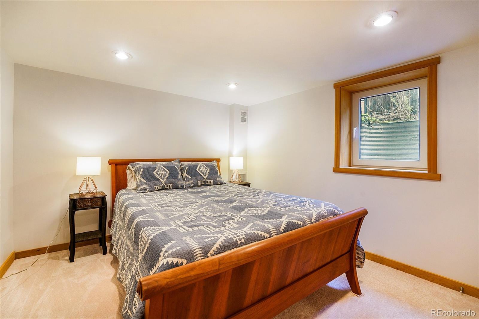 3548 Clay Street Denver, CO 80211 - Photo 25 of 30 a bedroom with a bed and window