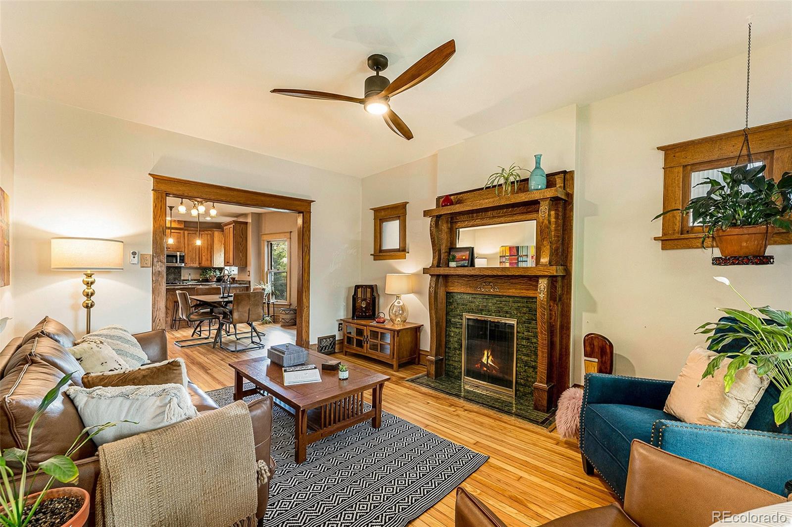 3548 Clay Street Denver, CO 80211 - Photo 3 of 30 a living room with furniture a fireplace and a flat screen tv