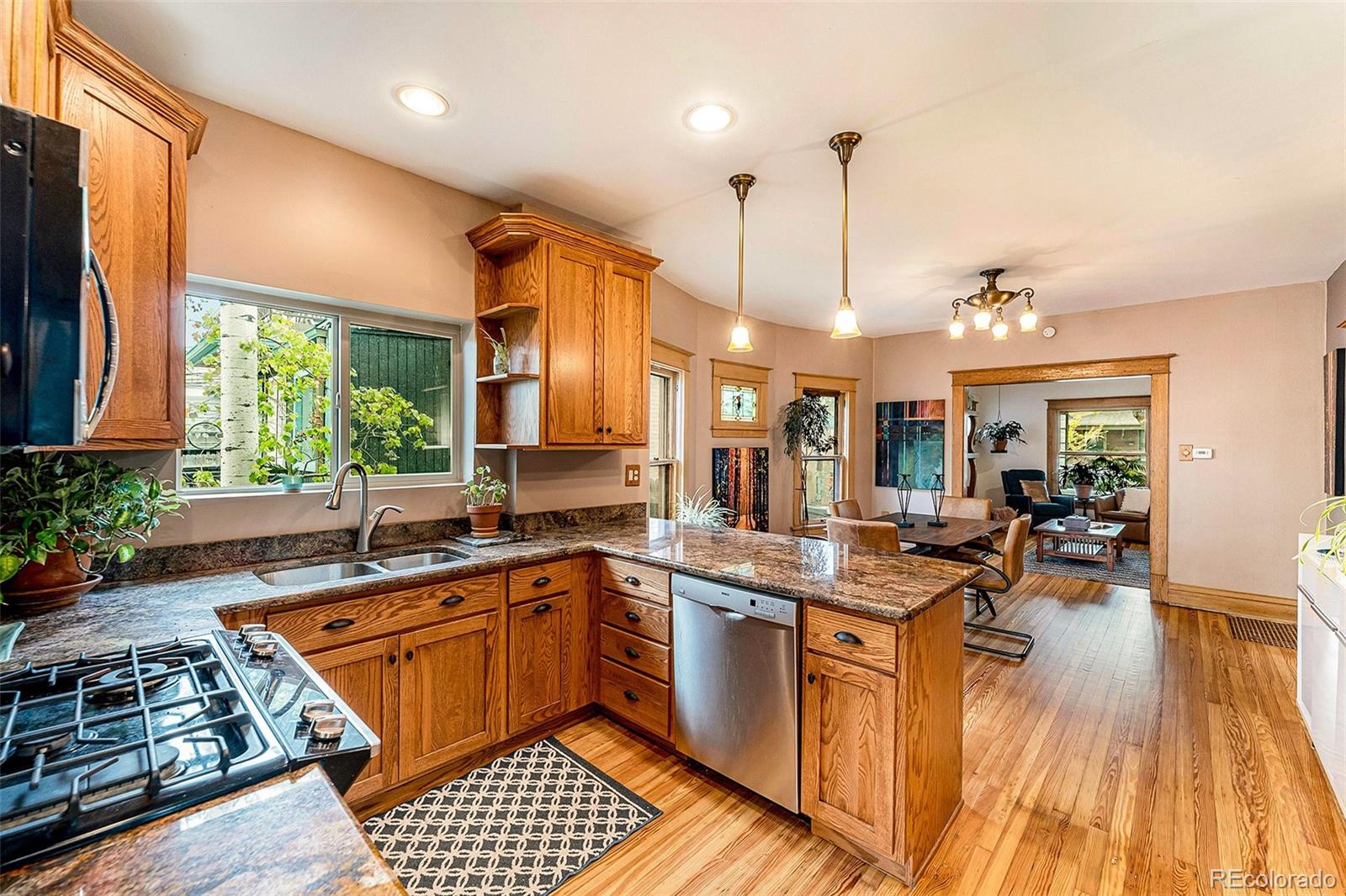 3548 Clay Street Denver, CO 80211 - Photo 9 of 30 a kitchen with a sink stove and cabinets