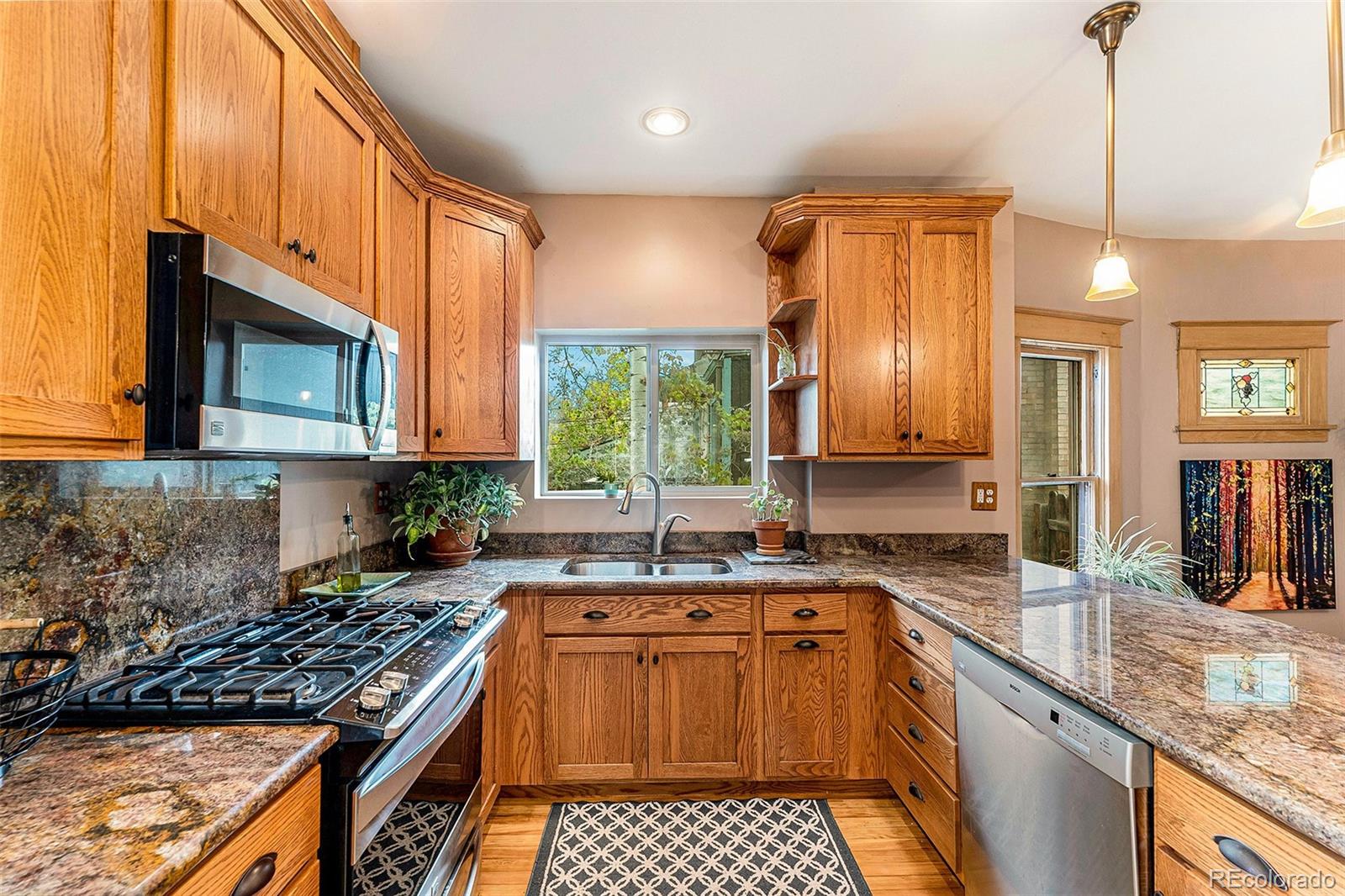 3548 Clay Street Denver, CO 80211 - Photo 10 of 30 a kitchen with a sink stove top oven and cabinets