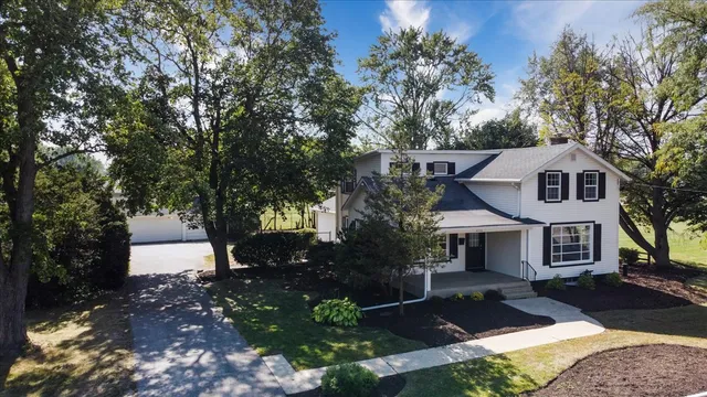 a view of house with outdoor space and street view