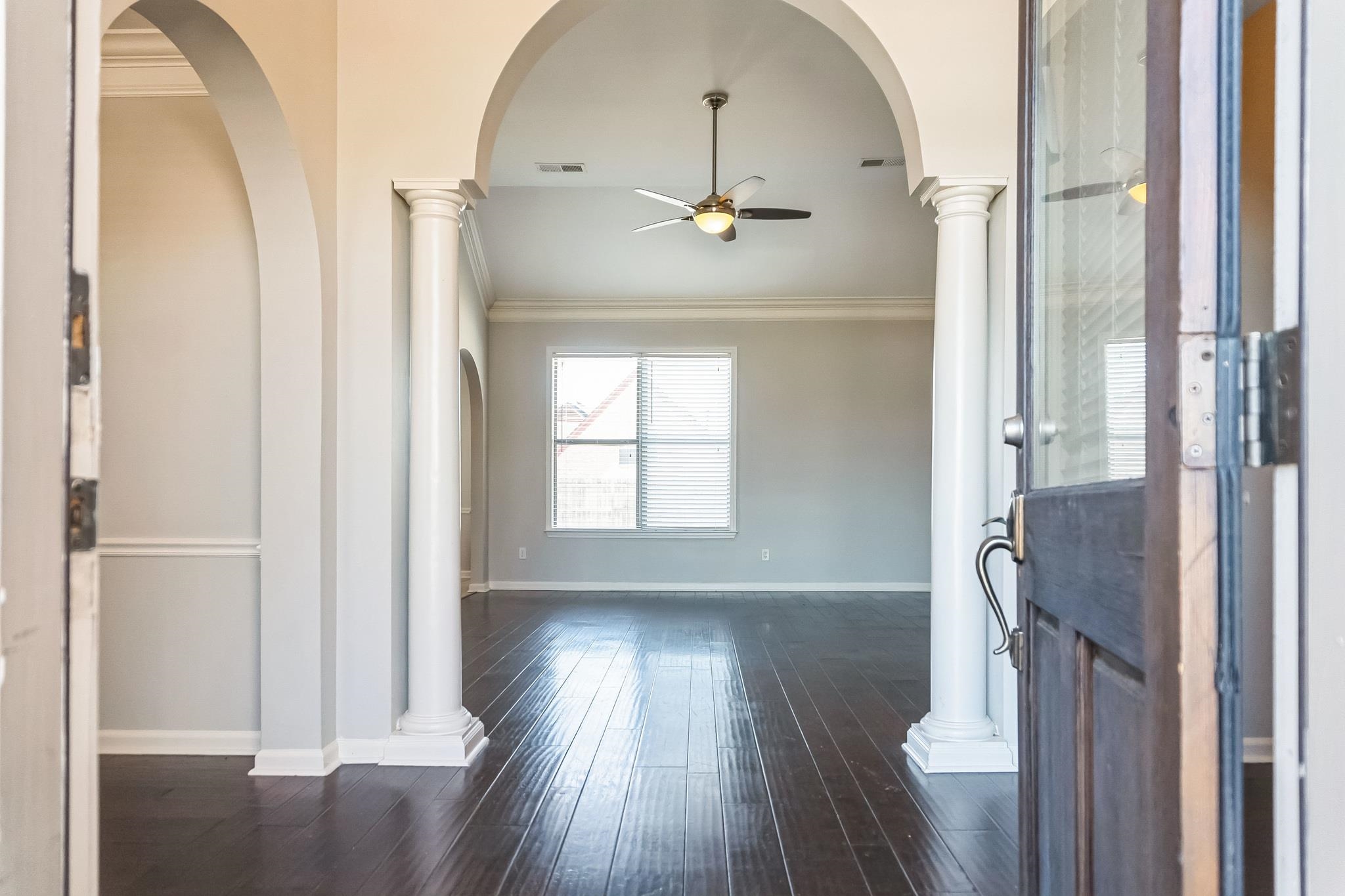 5225 Rockyford Road Bartlett, TN 38002 - Photo 2 of 18 Foyer entrance with dark hardwood / wood-style flooring, ceiling fan, and crown molding