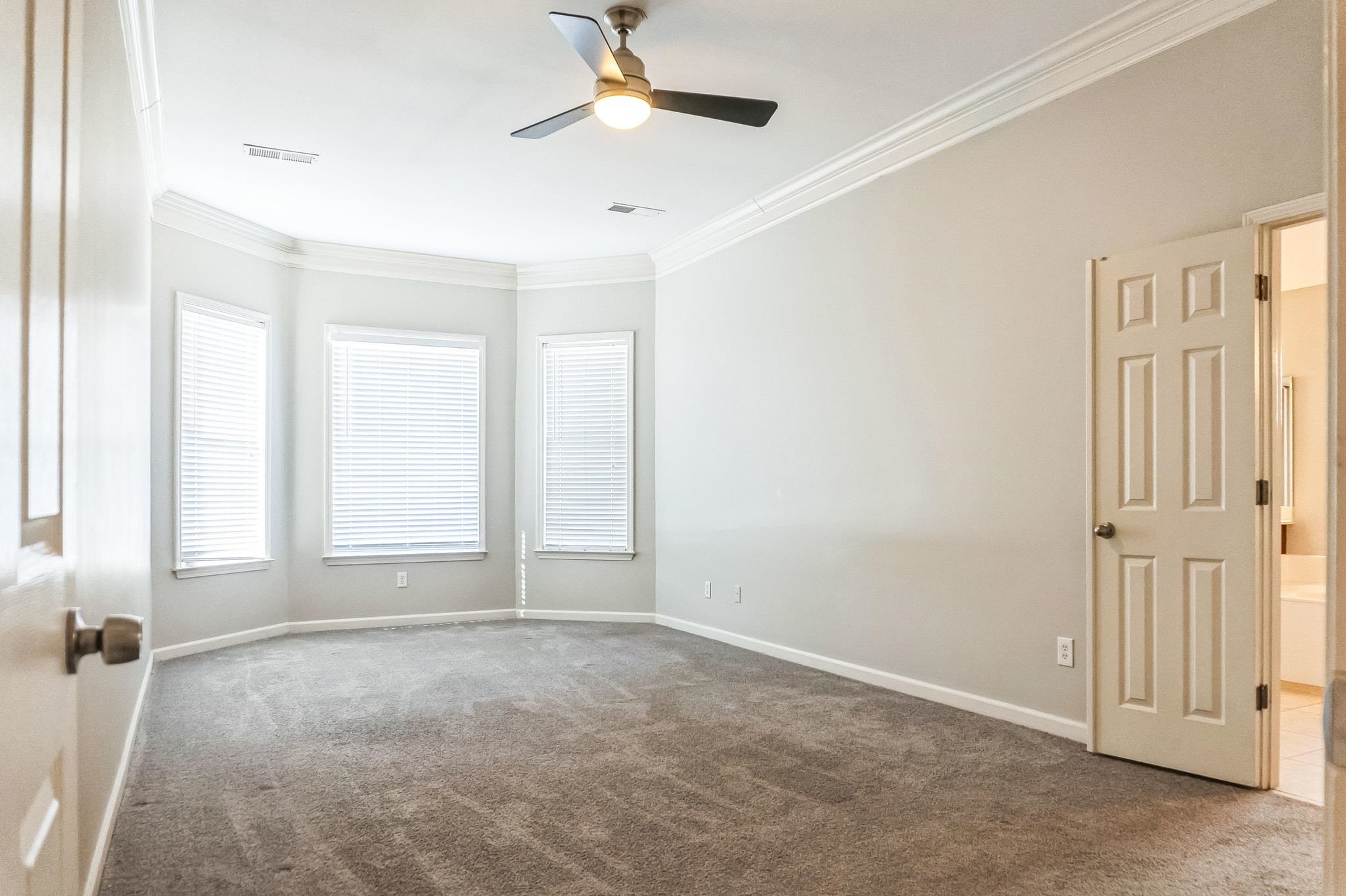 5225 Rockyford Road Bartlett, TN 38002 - Photo 10 of 18 Spare room featuring carpet flooring, ornamental molding, and ceiling fan