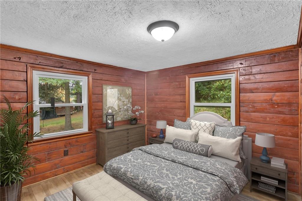 155 Harrold Street Jeannette, PA 15644 - Photo 25 of 37 a bedroom with a bed and a large window