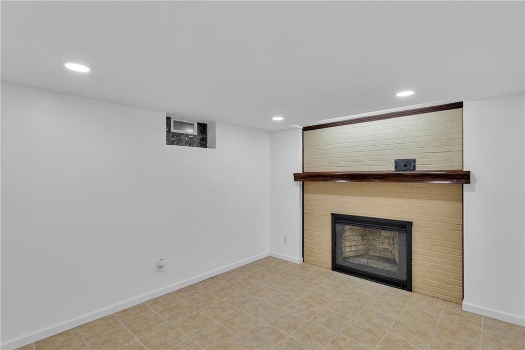 155 Harrold Street Jeannette, PA 15644 - Photo 28 of 37 a view of empty room with a fireplace