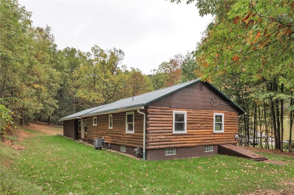 155 Harrold Street Jeannette, PA 15644 - Photo 34 of 37 a front view of a house with a garden