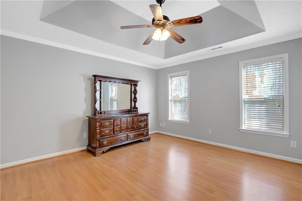 7 Buck Trail Newnan, GA 30265 - Photo 16 of 37 an empty room with windows and fan