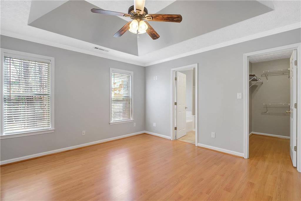 7 Buck Trail Newnan, GA 30265 - Photo 19 of 37 a view of an empty room with wooden floor and a window
