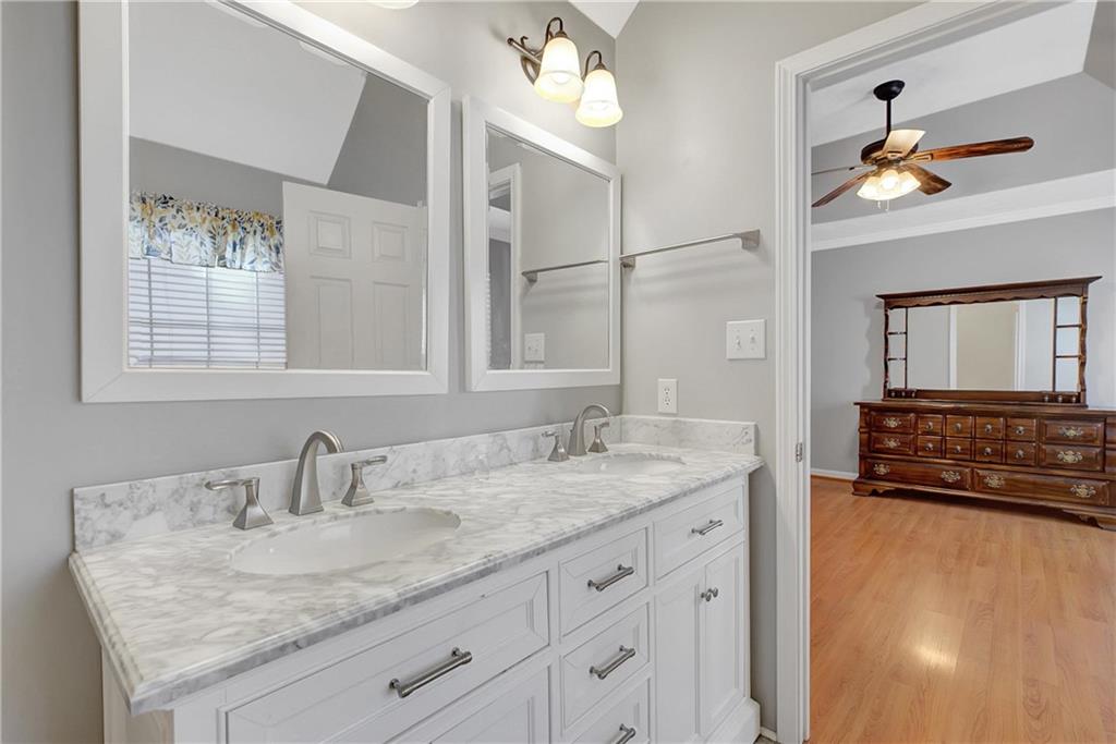 7 Buck Trail Newnan, GA 30265 - Photo 22 of 37 a bathroom with a granite countertop sink and a mirror