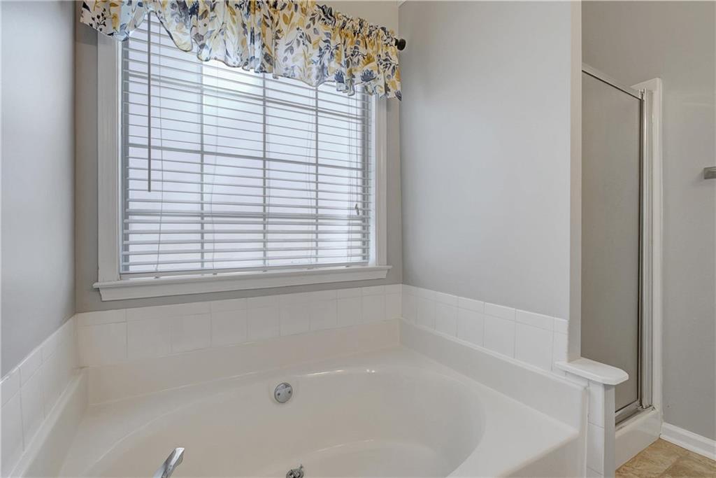 7 Buck Trail Newnan, GA 30265 - Photo 23 of 37 a white bath tub sitting next to a window