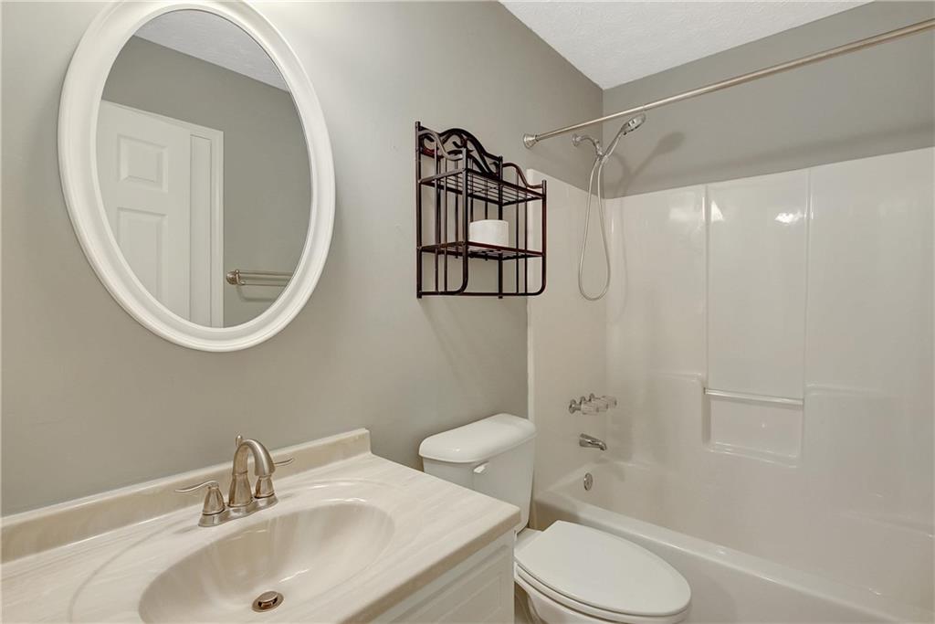 7 Buck Trail Newnan, GA 30265 - Photo 25 of 37 a bathroom with a sink toilet and shower