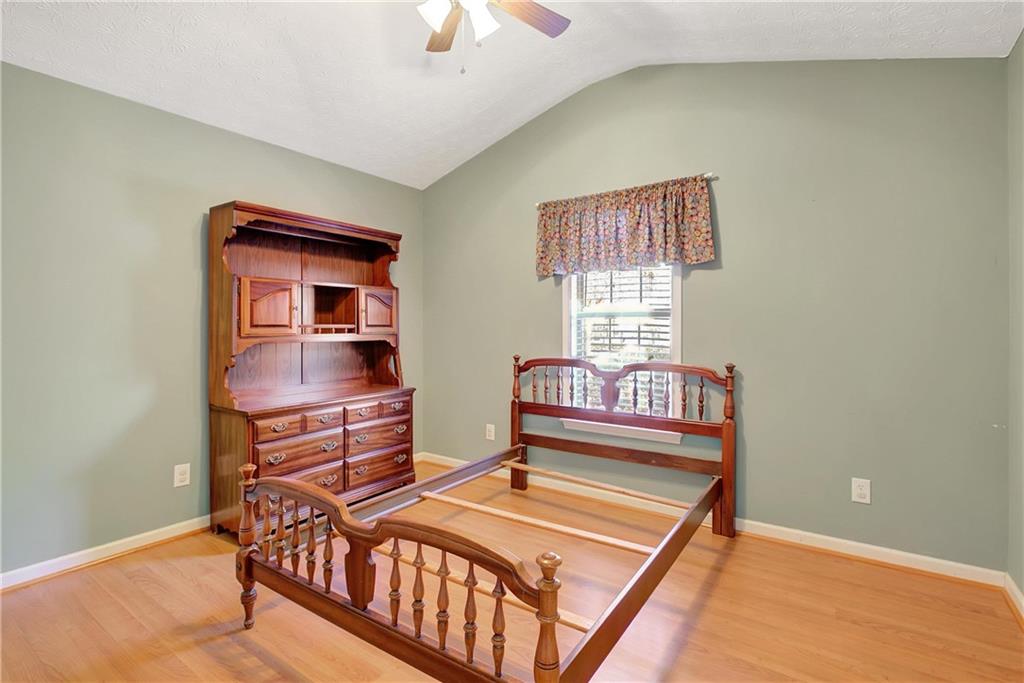 7 Buck Trail Newnan, GA 30265 - Photo 26 of 37 a bedroom with furniture and a window