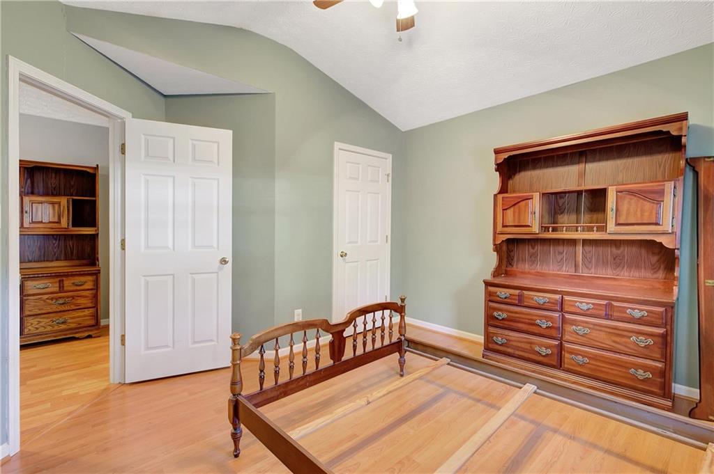 7 Buck Trail Newnan, GA 30265 - Photo 27 of 37 a bedroom with furniture and wooden floor