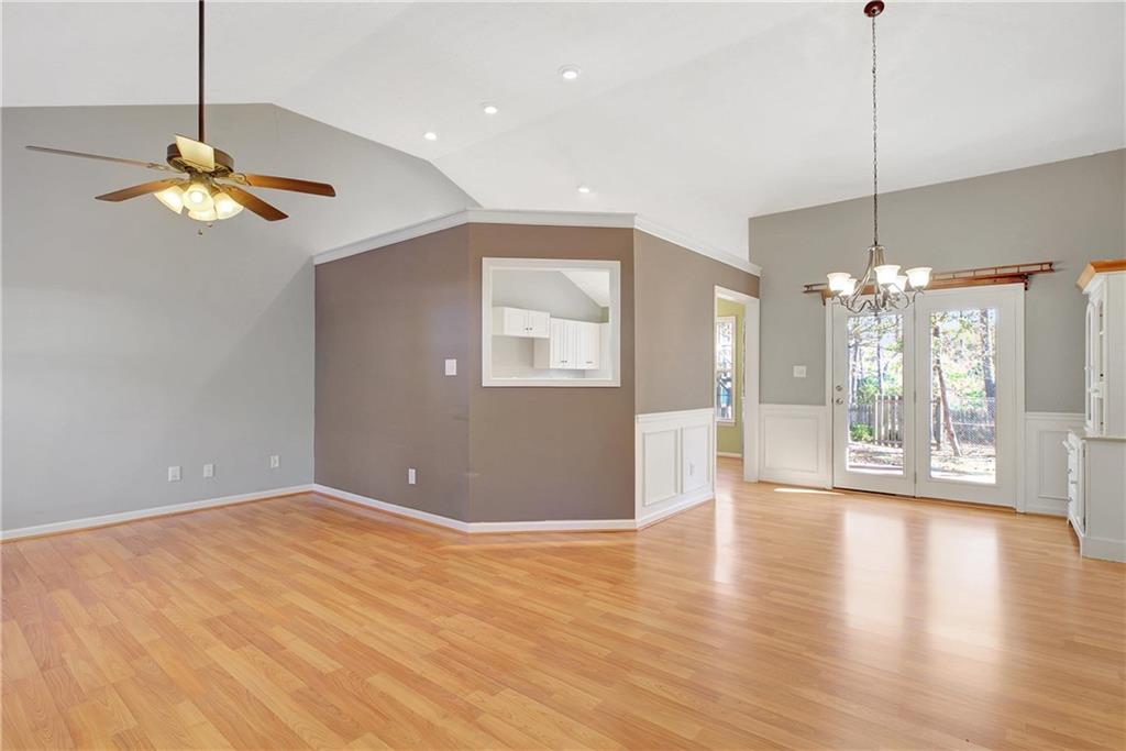 7 Buck Trail Newnan, GA 30265 - Photo 3 of 37 a view of an empty room with window and wooden floor
