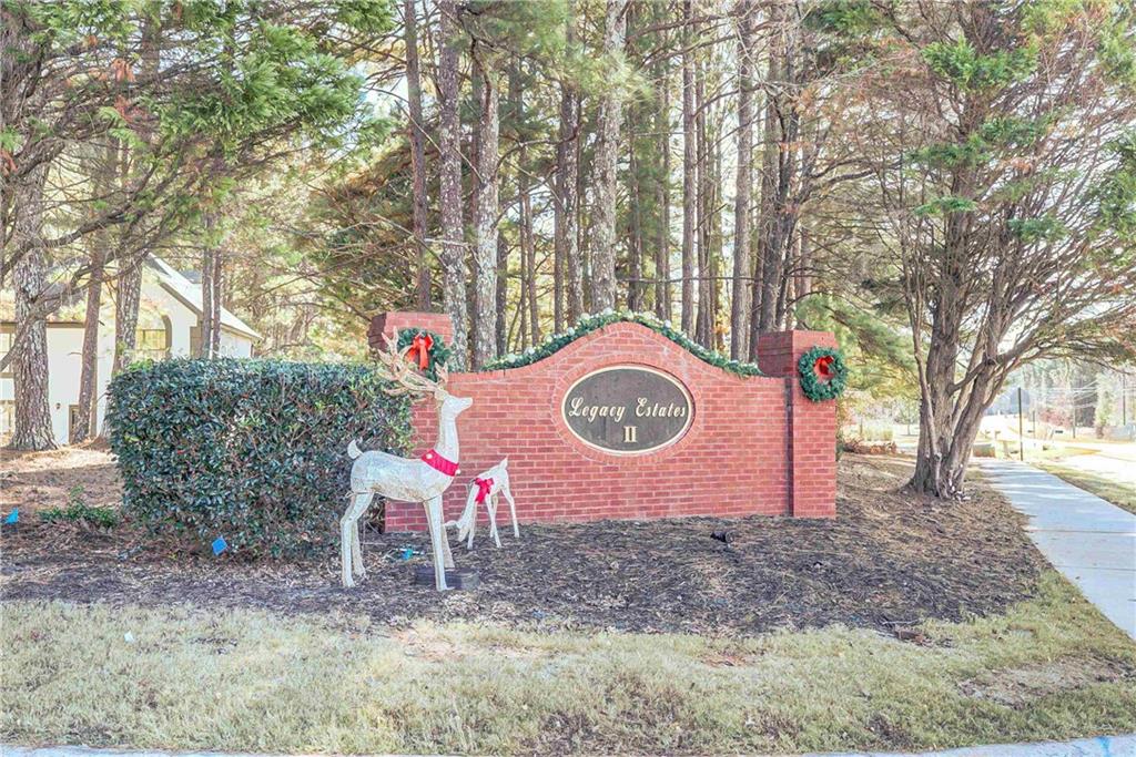 7 Buck Trail Newnan, GA 30265 - Photo 37 of 37 a backyard of a house with yard and retail shops