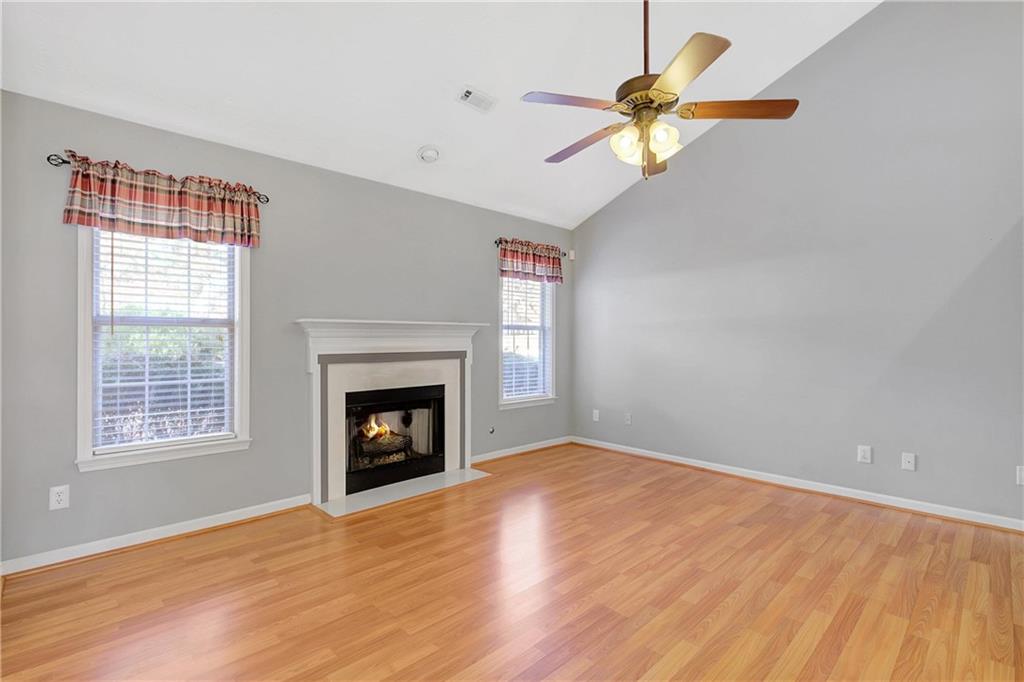 7 Buck Trail Newnan, GA 30265 - Photo 4 of 37 a view of an empty room with a window and fireplace