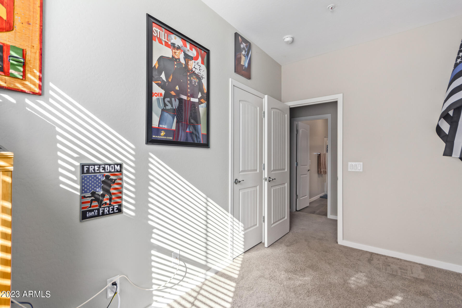 3900 East Baseline Road, Unit 168 Phoenix, AZ 85042 - Photo 15 of 19 a view of a hallway with paintings on the wall
