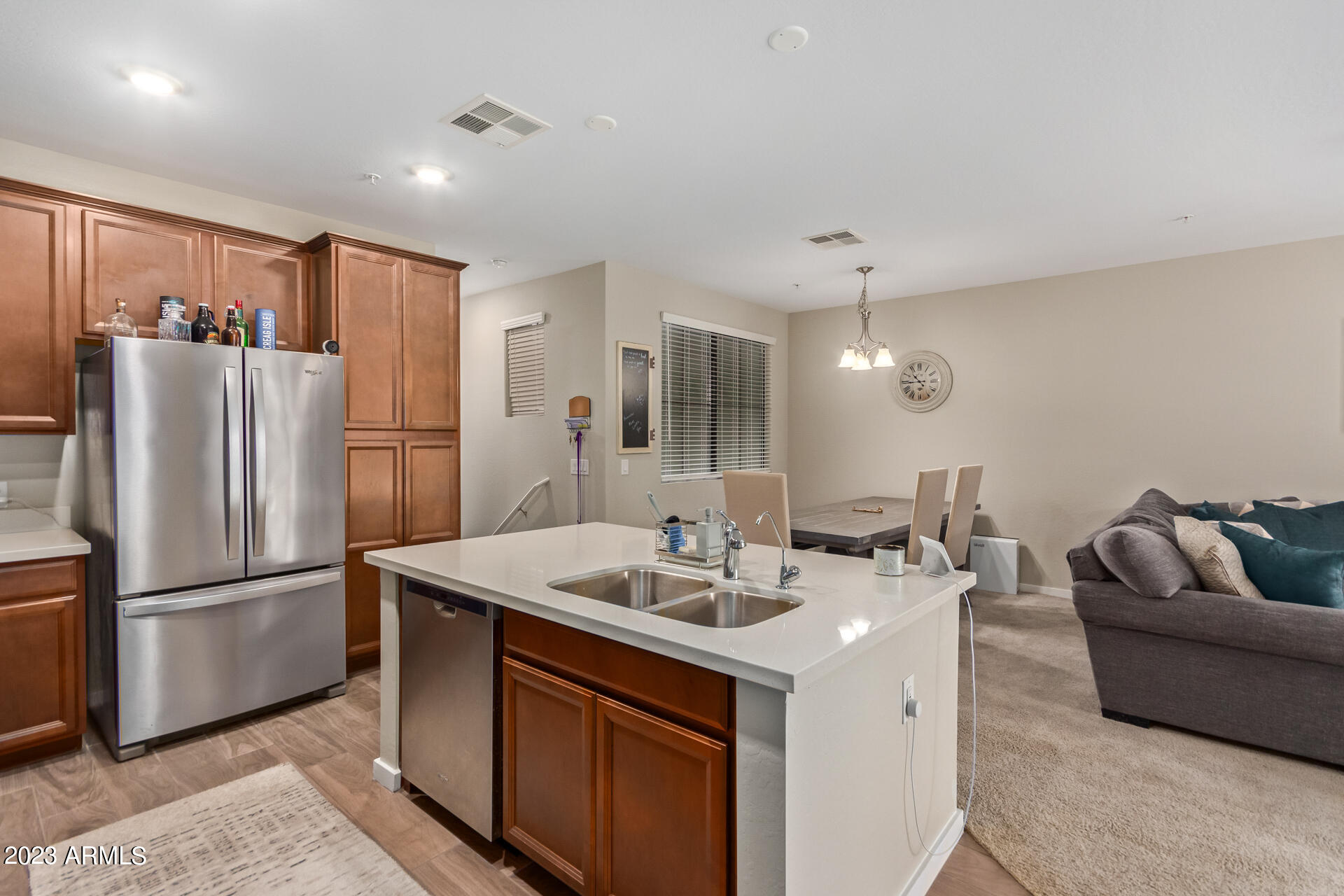 3900 East Baseline Road, Unit 168 Phoenix, AZ 85042 - Photo 5 of 19 a kitchen with stainless steel appliances granite countertop a refrigerator a sink a stove a dining table and chairs