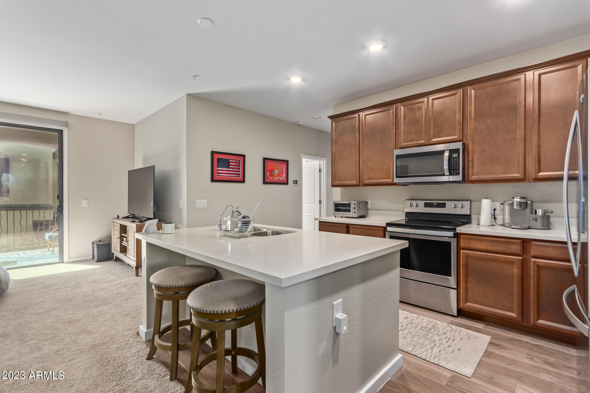 3900 East Baseline Road, Unit 168 Phoenix, AZ 85042 - Photo 8 of 19 a kitchen with a sink stove and microwave