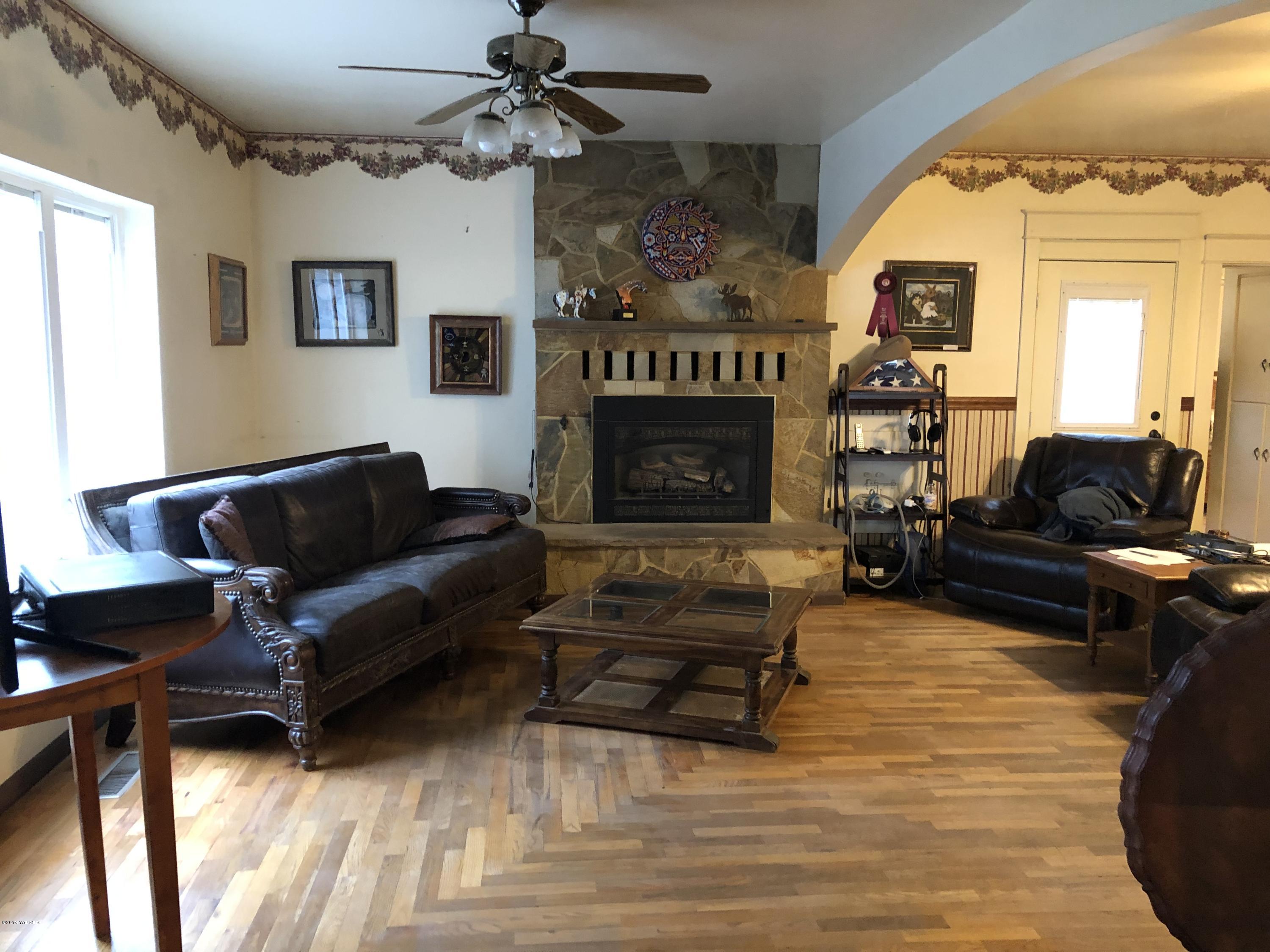 1152 South Rivard Road Moxee, WA 98936 - Photo 21 of 46 a living room with furniture and a fireplace