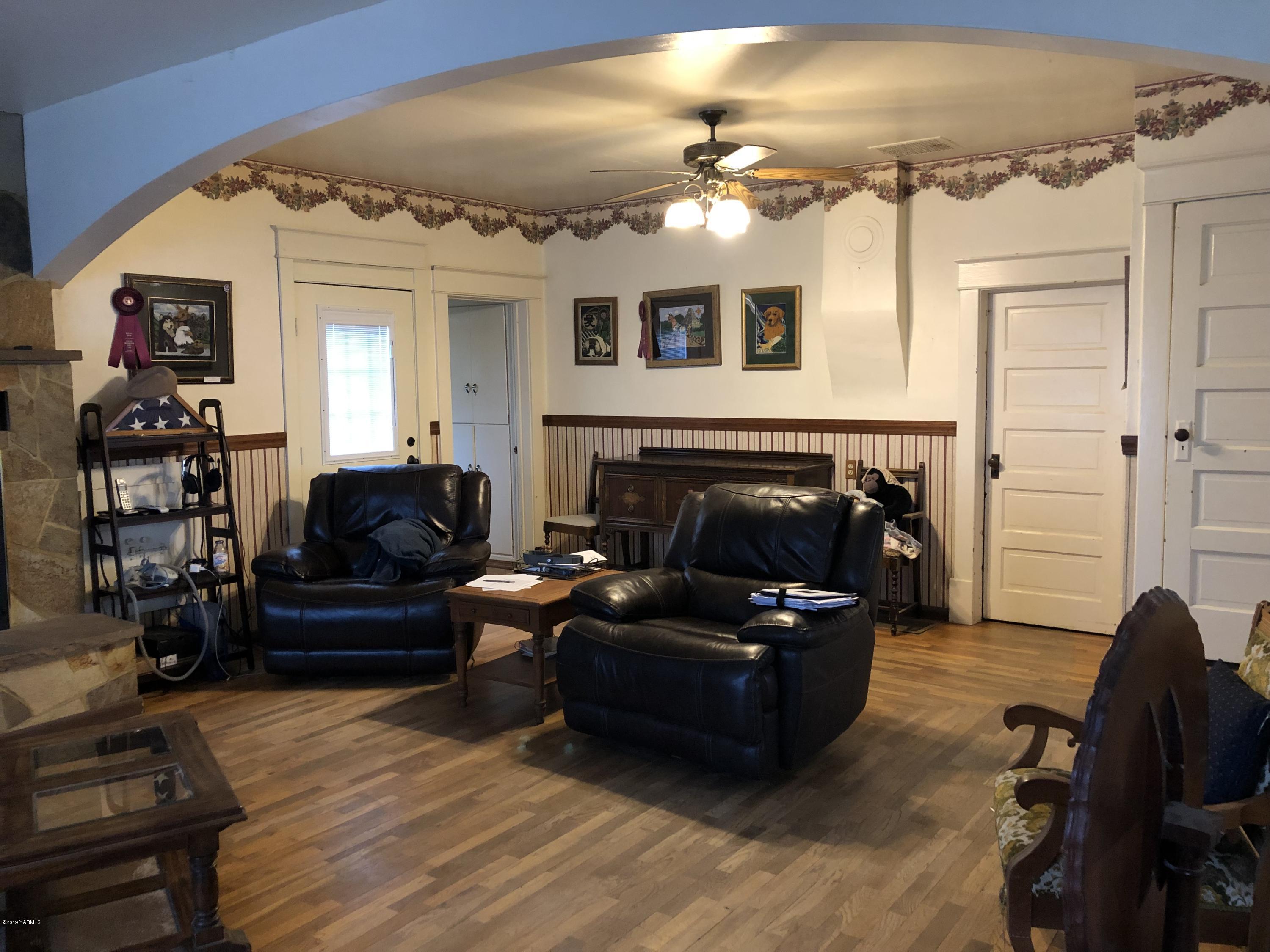 1152 South Rivard Road Moxee, WA 98936 - Photo 22 of 46 a living room with furniture and a fireplace
