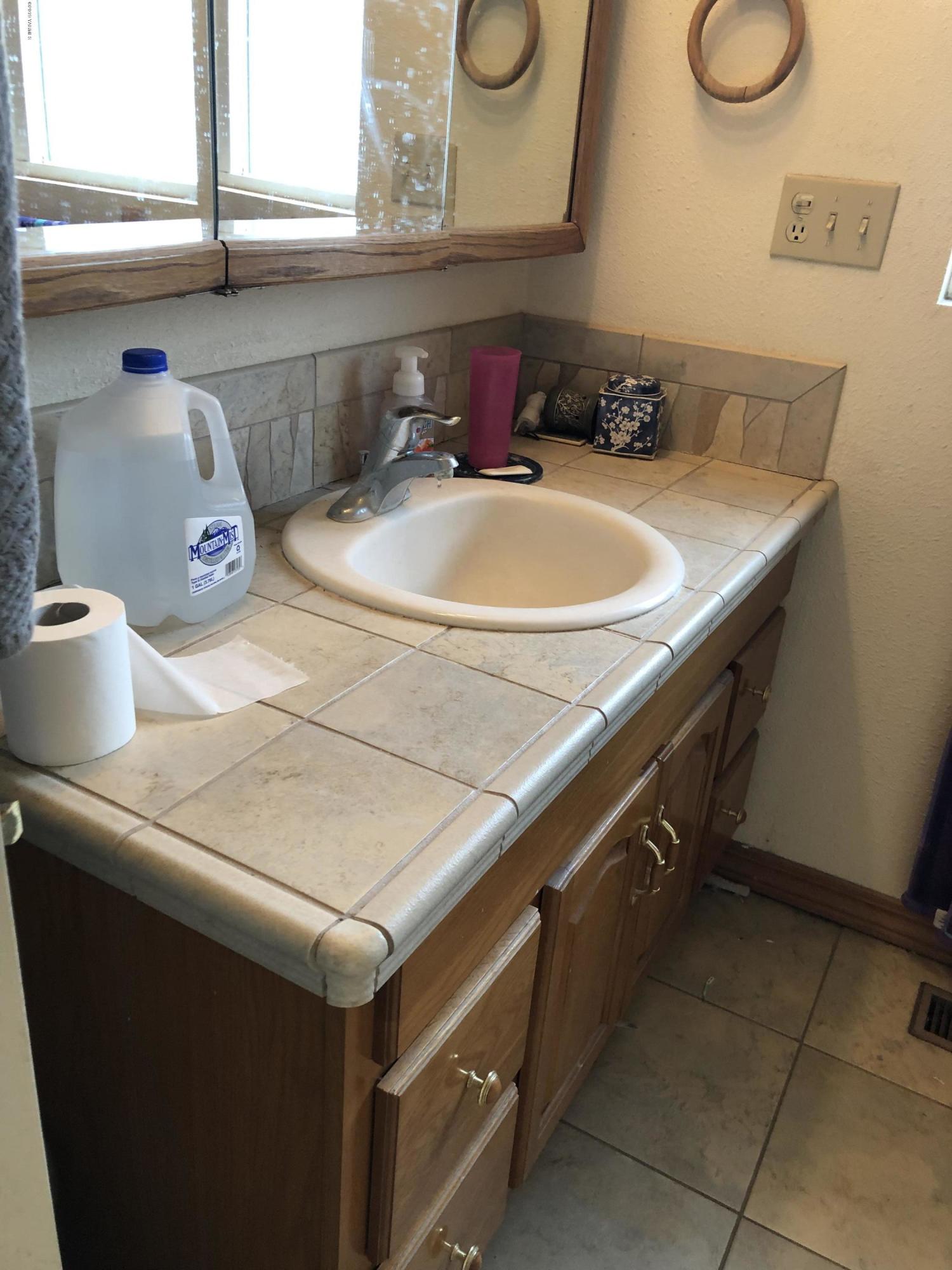 1152 South Rivard Road Moxee, WA 98936 - Photo 32 of 46 a bathroom with a sink and a mirror