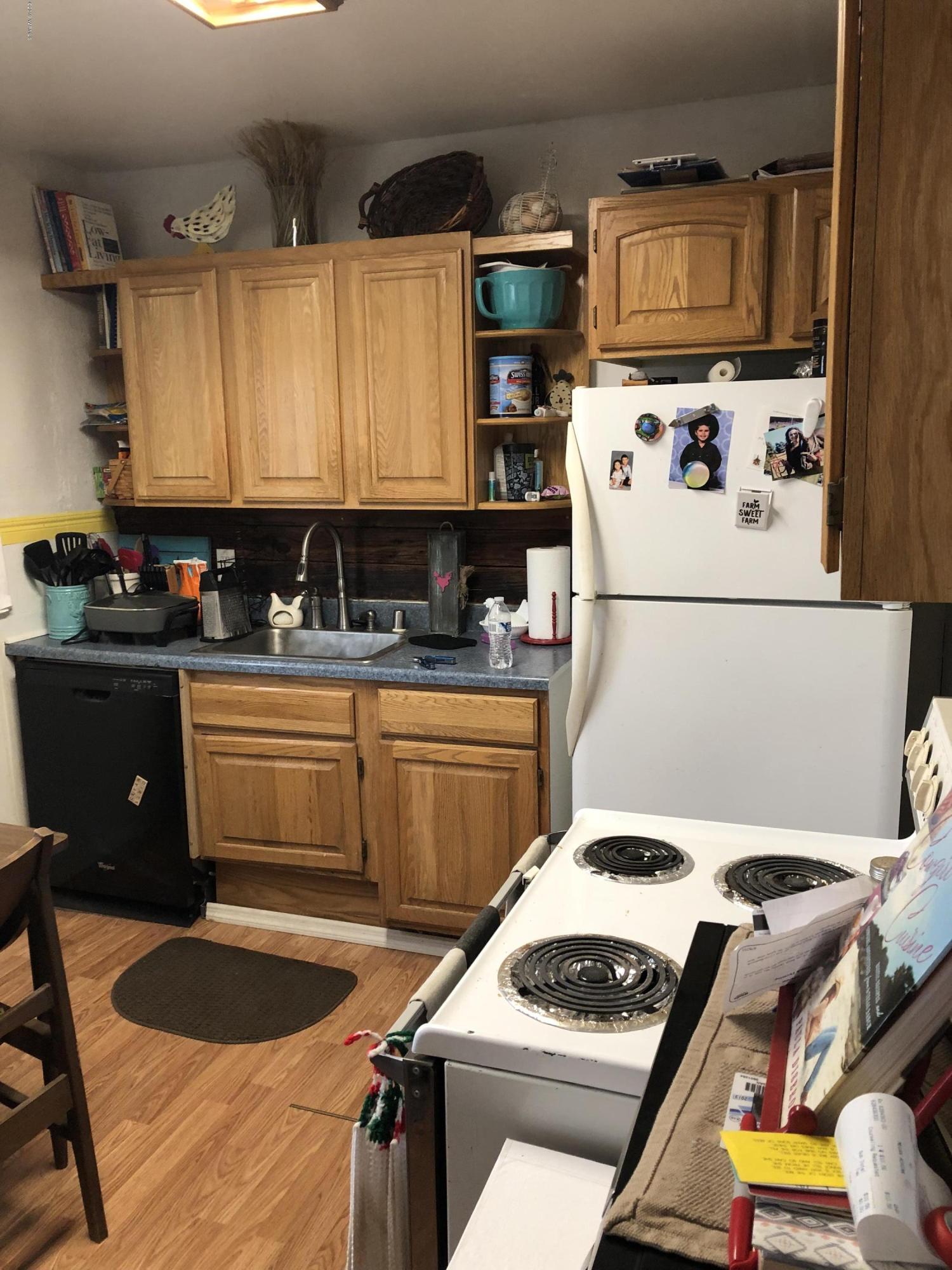 1152 South Rivard Road Moxee, WA 98936 - Photo 43 of 46 a kitchen with a appliances a stove a sink and a refrigerator