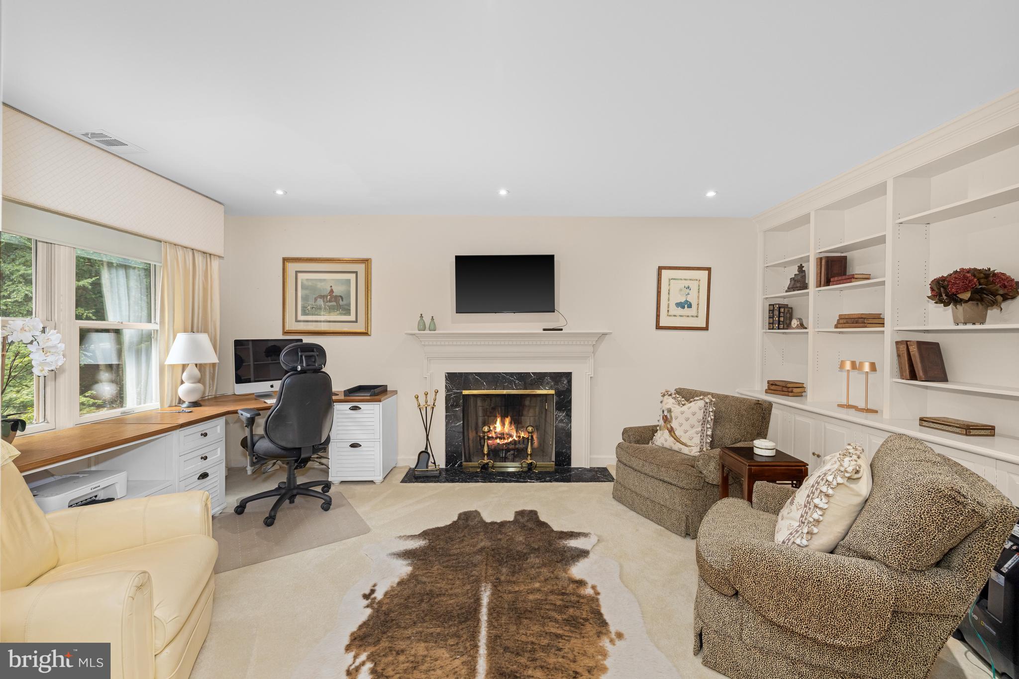 1332 Skipwith Road McLean, VA 22101 - Photo 12 of 35 a living room with furniture and a fireplace