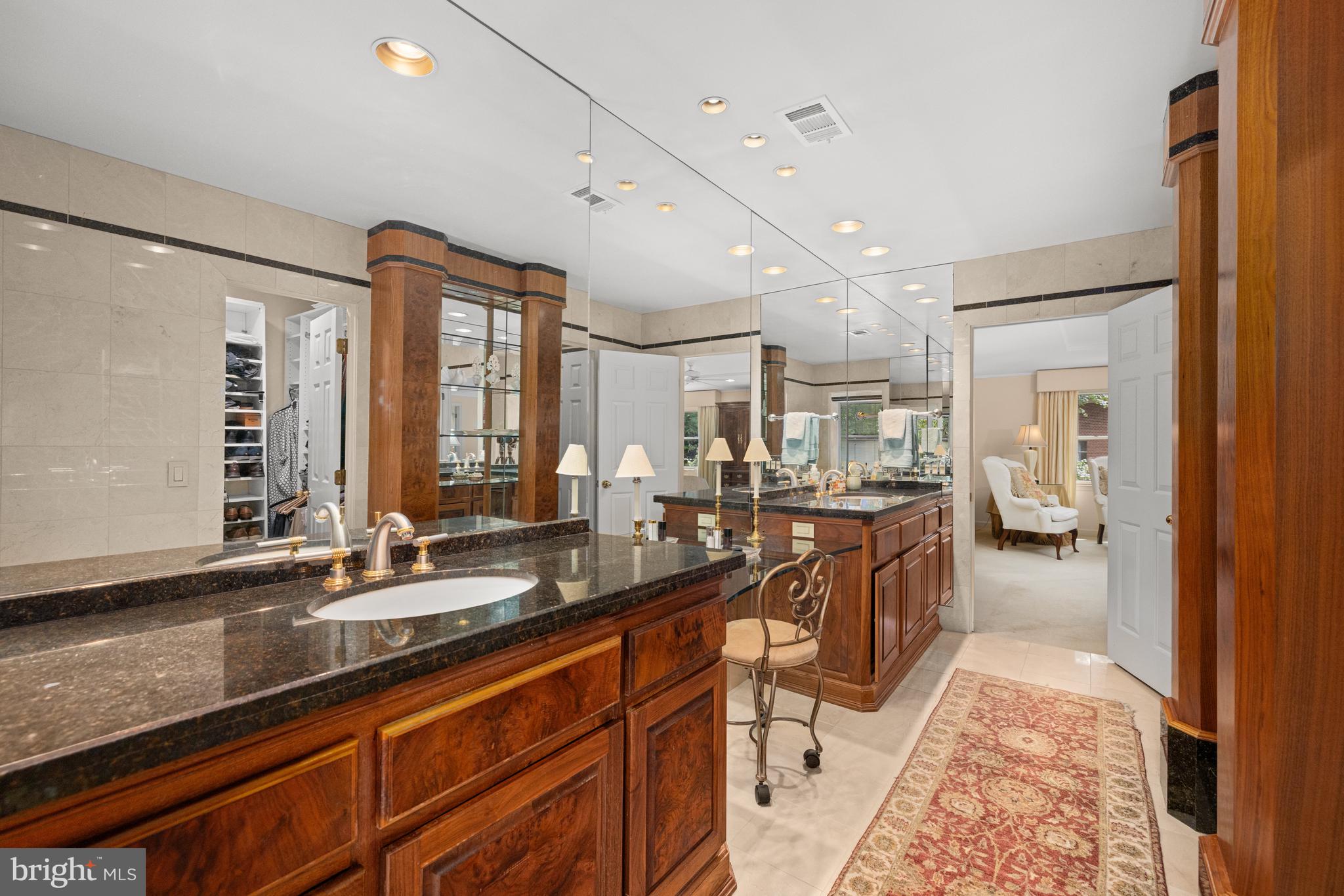1332 Skipwith Road McLean, VA 22101 - Photo 13 of 35 a large bathroom with double vanity sinks a large mirror and a shower