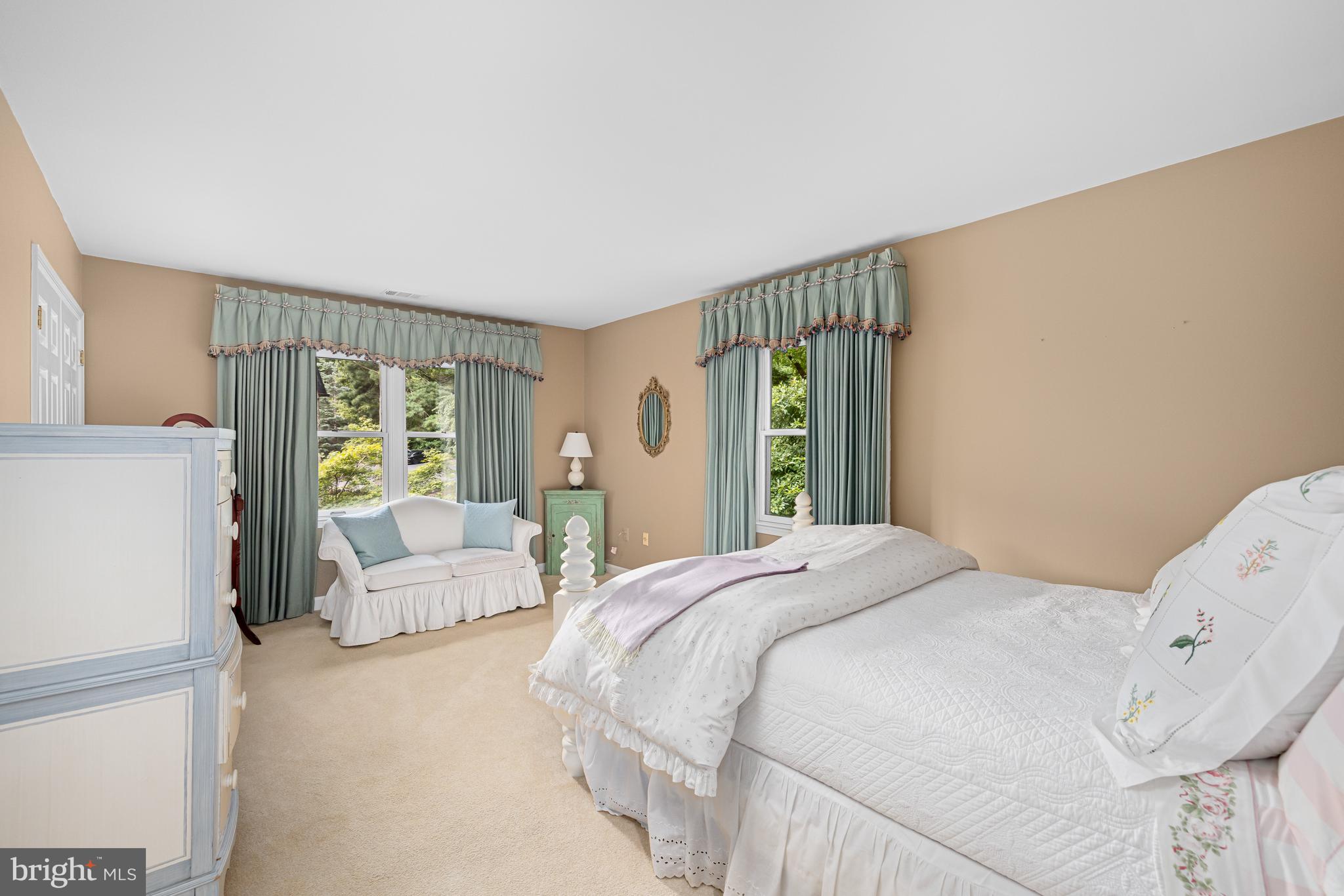 1332 Skipwith Road McLean, VA 22101 - Photo 19 of 35 a bedroom with a large bed and a couch