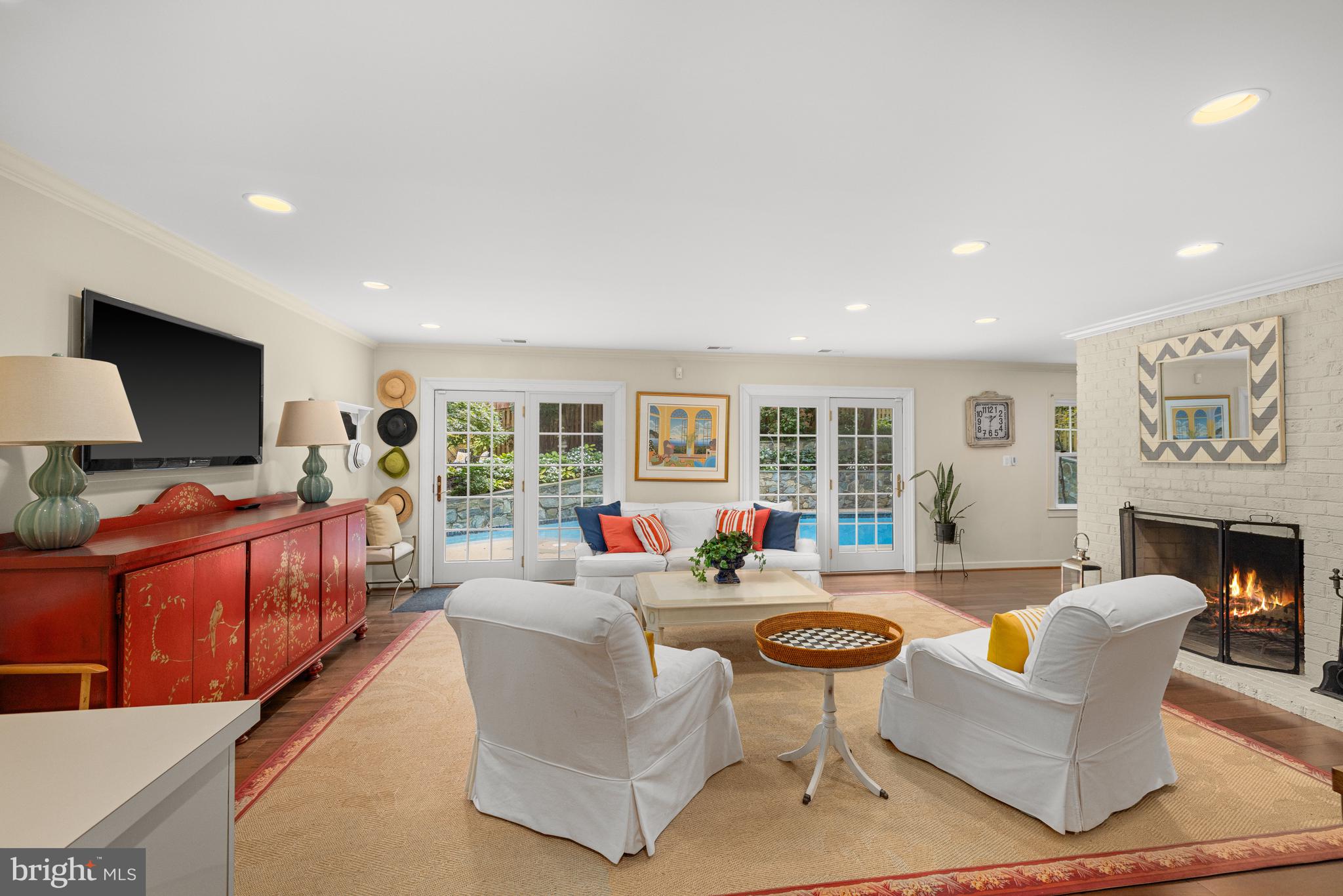 1332 Skipwith Road McLean, VA 22101 - Photo 25 of 35 a living room with fireplace furniture and a flat screen tv