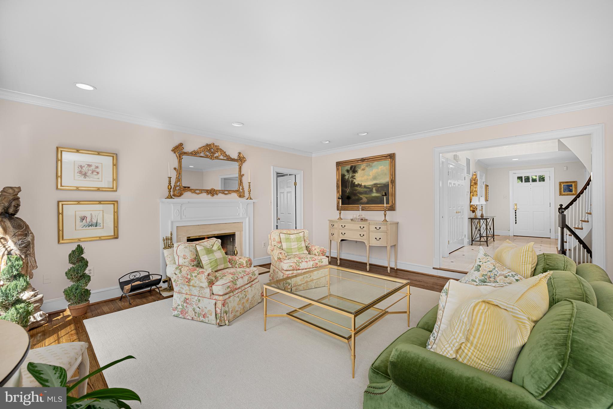 1332 Skipwith Road McLean, VA 22101 - Photo 4 of 35 a living room with furniture a fireplace and a flat screen tv