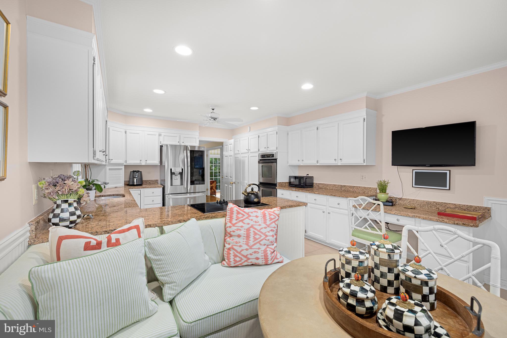 1332 Skipwith Road McLean, VA 22101 - Photo 7 of 35 a living room with furniture and a flat screen tv