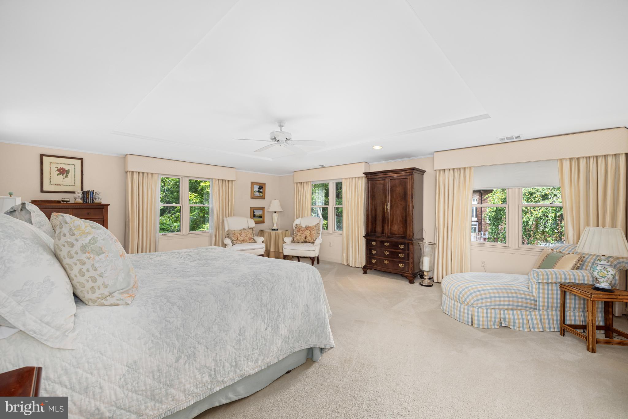 1332 Skipwith Road McLean, VA 22101 - Photo 10 of 35 a spacious bedroom with a bed a table and large window
