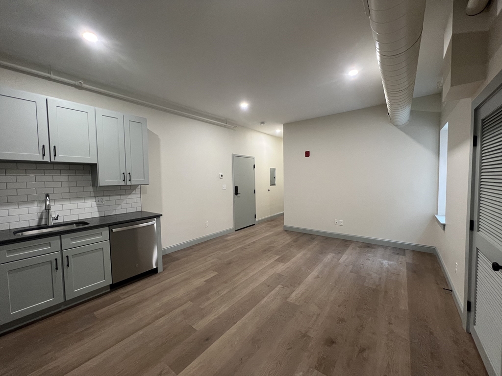 160 Seabury Street, Unit 4 Fall River, MA 02720 - Photo 3 of 10 a kitchen with a sink and wooden floor