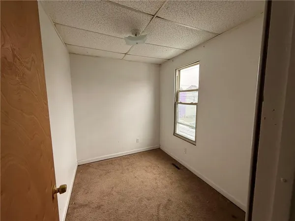 a view of empty room with windows