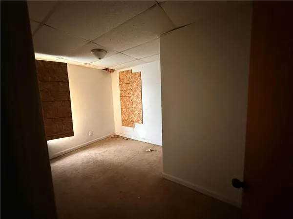 a view of an empty room with a window