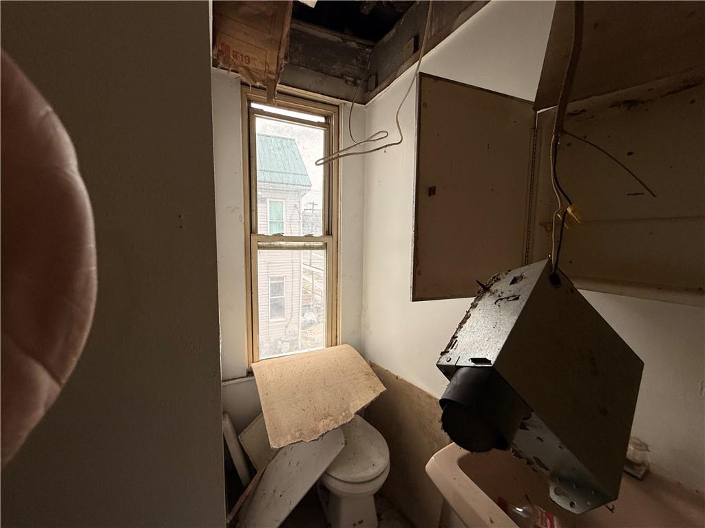 404 East Locust Street Butler, PA 16001 - Photo 9 of 20 a living room with furniture and a window